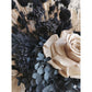 Black, nude & gold dried flowers set in to a black pot. Picture shows a close up of the flowers