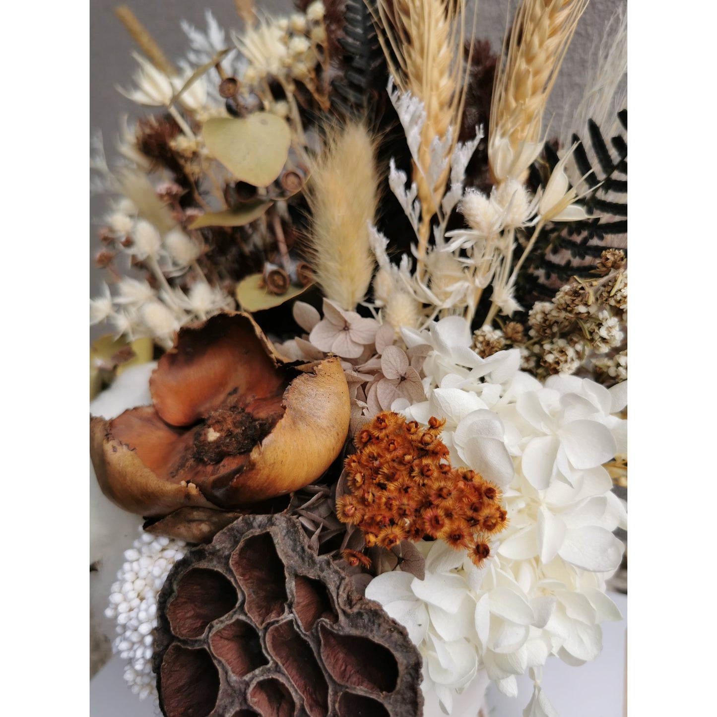 Dried & Preserved native flower arrangement in white pot. Picture shows flower arrangement zoomed in for a closer  view of the flowers