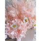 Dried & Preserved flower arrangement in pretty pink with 3 white daisies. Flowers are set in to a mini pink arch vase. Picture is showing a close up view of the flowers
