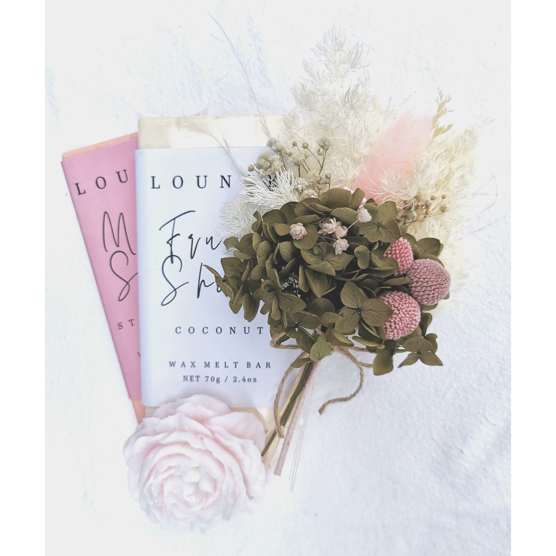 Gift Box Hamper with 2x soy wax melts, pink peony candle &  pink, green & white dried flower posy. Photo shows a picture of the products in a bundle up close 