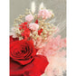 Valentines Day dried & preserved flower arrangement with 2 red preserved roses and pink, red & white flowers and set in to a pink flower pot. Photo shows a close up photo of the rose and flowers