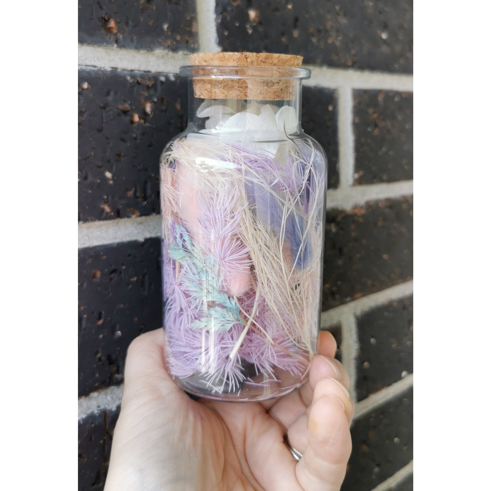 Pastel flower confetti offcuts in a bottle with cork lid